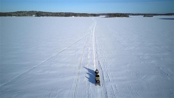 Ice fishing tour by snowmobile and sleigh